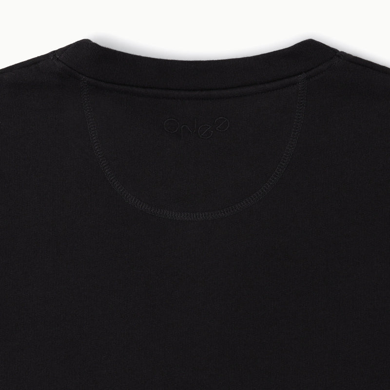 ONE Essentials black organic sweatshirt, logo shown on the back neckline embroidered with black thread.